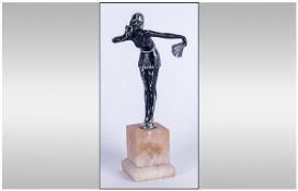 Art Deco Figure Of Young Woman Dancer Holding A Silver Fan raised on alabaster base. Circa 1930's.