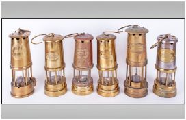 Collection Of Six Brass Miners Lamps, various heights
