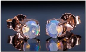 Welo Opal Stud Earrings, round cut, faceted opals from the Welo mine in Ethiopia, totalling .5ct,