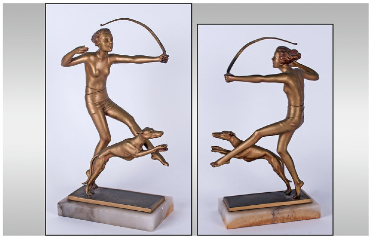 Art Deco Fine Quality Spelter Figure in the form of a semi-naked woman huntress with bow & dog  in
