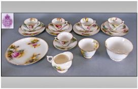 Royal Worcester Handpainted Part 18 Piece Tea Service decorated with images of roses, date 1912.