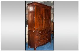 Early 19th Century Mahogany Linen Press, storage cupboard above two short & two long drawers. Raised