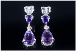 Pair of Amethyst Drop Earrings, pear cut, rich purple amethysts suspended from smaller, pear cut,