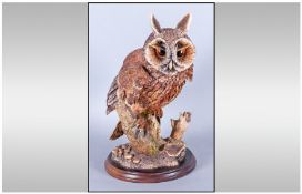Thistle Green Long Ear Owl figure, perched on a tree stump. 12 inches in height