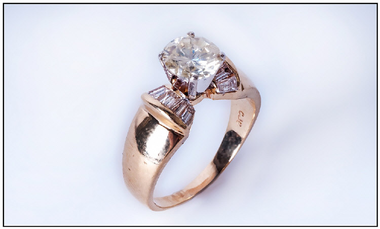 14ct Gold Diamond Ring Set With A Central Round Modern Brilliant Cut Diamond Between Tapered