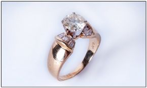 14ct Gold Diamond Ring Set With A Central Round Modern Brilliant Cut Diamond Between Tapered