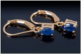 Blue Sapphire Drop Earrings, oval cut, midnight blue sapphires in 14ct gold and silver lever back