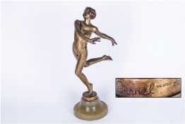Lorenzl Signed Art Deco Figure Of A Rare Nude Dancing Girl, standing on one leg with both arms