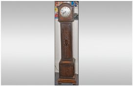 Oak Cased Grandmother Clock, with silvered dial and Arabic numerals. 58 inches high.