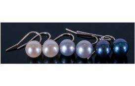 Three Pairs of Freshwater Pearl Drop Earrings, peacock, white and silver grey, each pearl a pear