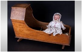 Wooden Crib and Bisque Headed Doll.