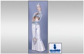 Lladro Figure 'Walk With The Dog' model number 4893, issued 1974. 14.5" in height, mint condition.