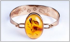 9ct Gold Bracelet/Bangle, The Front Set With A Large Oval Polished Amber, Feature Hallmarks. gross