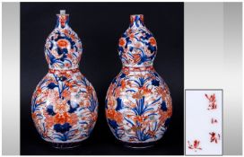 A Pair Of Imari Gourd Shape Vases, Japanese character marks to bases. Each 11 inches in height.