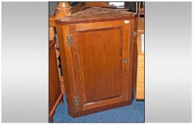 Late Georgian Hanging Wall Corner Cupboard. single door with brass hinges. Mahogany veneered top