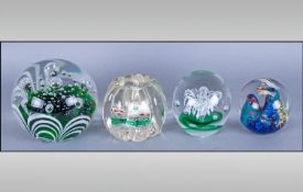 Four Glass Bubble Paperweights including Millefiori, various styles, colours and sizes.