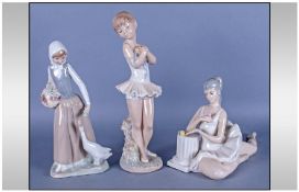 Three Figures comprising  Nao by Lladro Figure of a young ballet dancer, firl with goose figure