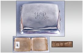 A Silver Cigarette Case with gilt interior and of plain form, Hallmark Birmingham 1917. 97.4