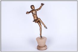 Art Deco Cold Painted Spelter Figure Of A Dancing Girl, raised on a alabaster base, Circa 1933.