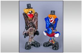 A Pair Of Murano Glass Clown Figures, in coloured brown glass. 8" & 6" in height.