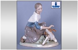Lladro Figure 'Caressing A Little Calf' model  number 4827, sculptured by Salvador Furio. Issued