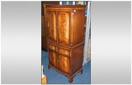 Mahogany Serpentine Shaped Cocktail Cabinet with two cupboards above with fitted shelf. A slide to