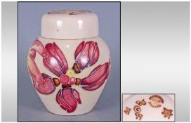 Moorcroft Small Lidded Ginger Jar. Frangipani pattern. Designer Emma Bossons. Date 14/7/01. Stands