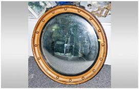 Reproduction Gesso Convex Gilt Framed Mirror. In typical Regency Style. 22 inches in diameter.