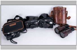 Pair of Lemain Paris Binoculars in leather case. Together with three cameras, Minolta, Konica C35