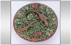 Portugese Polissey Majolica Circular Dish with reptiles & beetles. Circa 1890 on a green textured