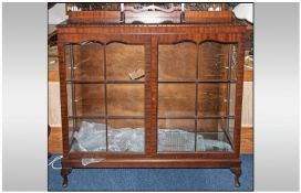 Mahogany Display Cabinet. Glazed Front Centre Opening, Standing on Four Tapering Feet with