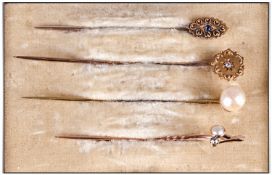 Collection Of Four 9ct & 15ct Gold Stick Pins. Set with odd Diamond chips, seed pearls & Sapphire.