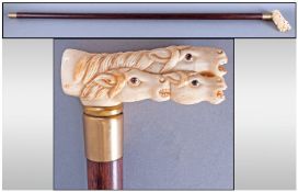 Carved Ivory Handled Walking Cane, Modelled In The Form Of Four Horse Heads, Brass Mounts. Length 35