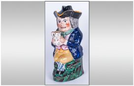 Foaming Ale Toby Jug and Cover, 19thC Staffordshire polychrome, seated cross legged Toby, clasping a