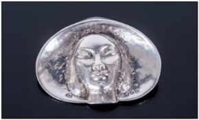WITHDRAWN   Unusual Heavy Cast Silver Brooch dated 1945, depicting an oriental girl in a large