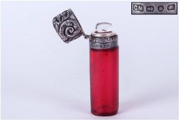 Late Victorian Cranberry Glass Scent Bottle, hinged silver embossed lid & collar. Hallmark