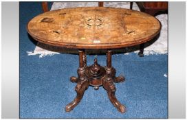 Victorian Occassional Table, inlaid oval top, raised on quatrefoil base. 21x36", 27" in height. A/