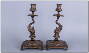 Pair Antique Florentine Cast Bronze Candlesticks in the form of a Dolphin Holding up the Sconces, On