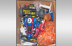 A Box of mixed toys to include Cars trucks bikes and a bag of action figures.