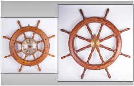 Two Reproduction Ships Wheels, one 36 inches in diameter, with a central brass hub. The second 21