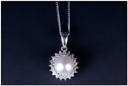 9ct White Gold Diamond And Pearl Pendant With Central Pearl Surrounded By Round Cut Diamonds