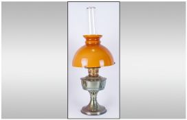 Early 20th Century Brass and Glass Oil Lamp. With amber coloured shade.