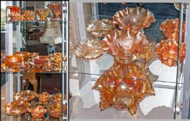Quantity of Carnival Glass (18) pieces in total. Includes cups, pedestal bowl, bowls, cups and