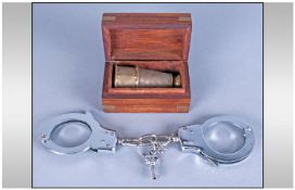 Miniature Telescrope, in wooden box plus handcuffs with keys.