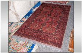 Authentic Turkish Wool Rug 50 by 77 inches. Predominantly red in colour.