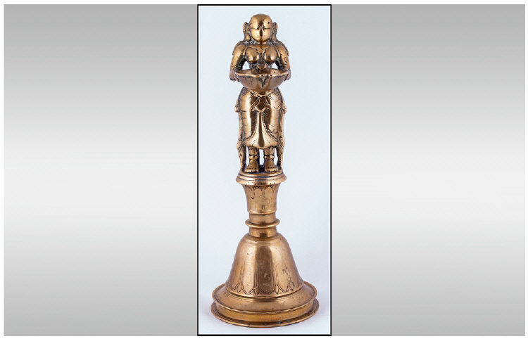 Rare Indian Jain Bronze Sacred Figural Oil Burner, depicting a maiden holding the oil bowl burner,