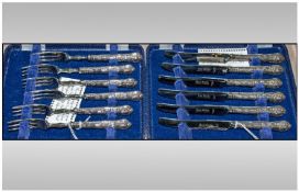 Two Cased Sets Of Dessert Knives And Forks. Kings pattern embossed silver handles, hallmarked for