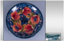 William Moorcroft Signed Shallow Bowl, pomegranates leaves and berries pattern, circa 1920`s. Label