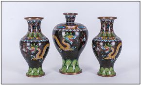 Chinese Cloisonna Garniture Of Three Vases, finely enamelled with coiling dragons. The central vase