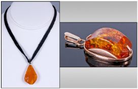 Russian 14ct Gold Set Amber Pendant, 1.25`` in height, Plus a large amber pendant on a black